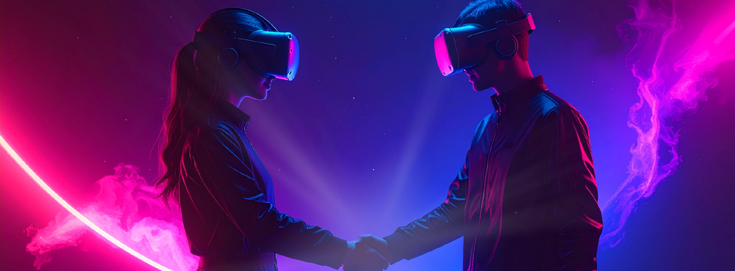 Due partecipanti con visori per la realtà virtuale si stringono la mano durante un hackathon
